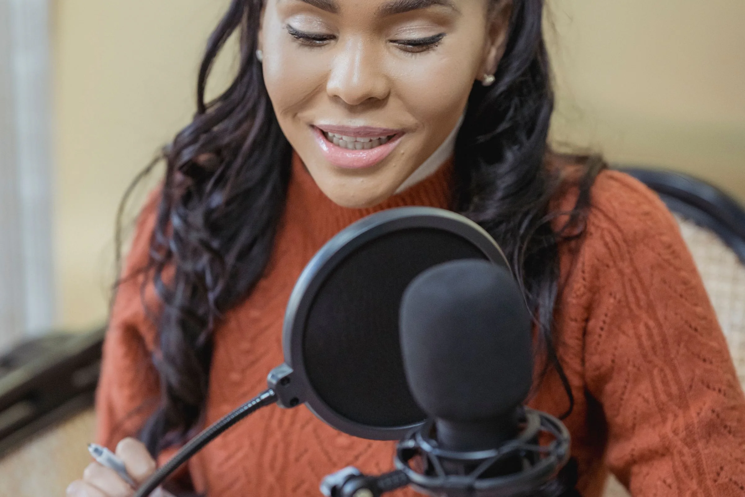 A media creator recording in a studio
